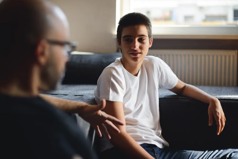 Father and son spending time together talking.